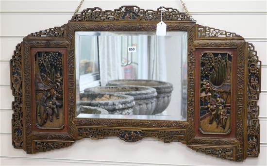 A Chinese carved wall mirror W.101cm